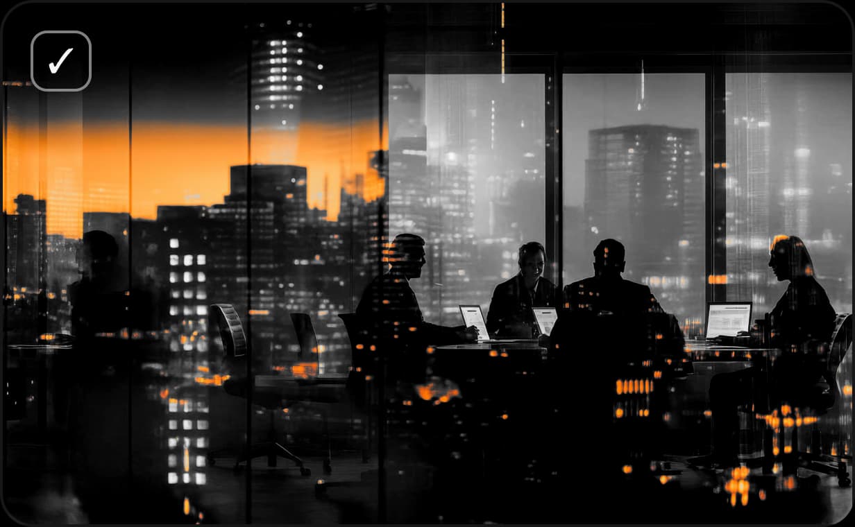 Leadership team working late with city skyline view