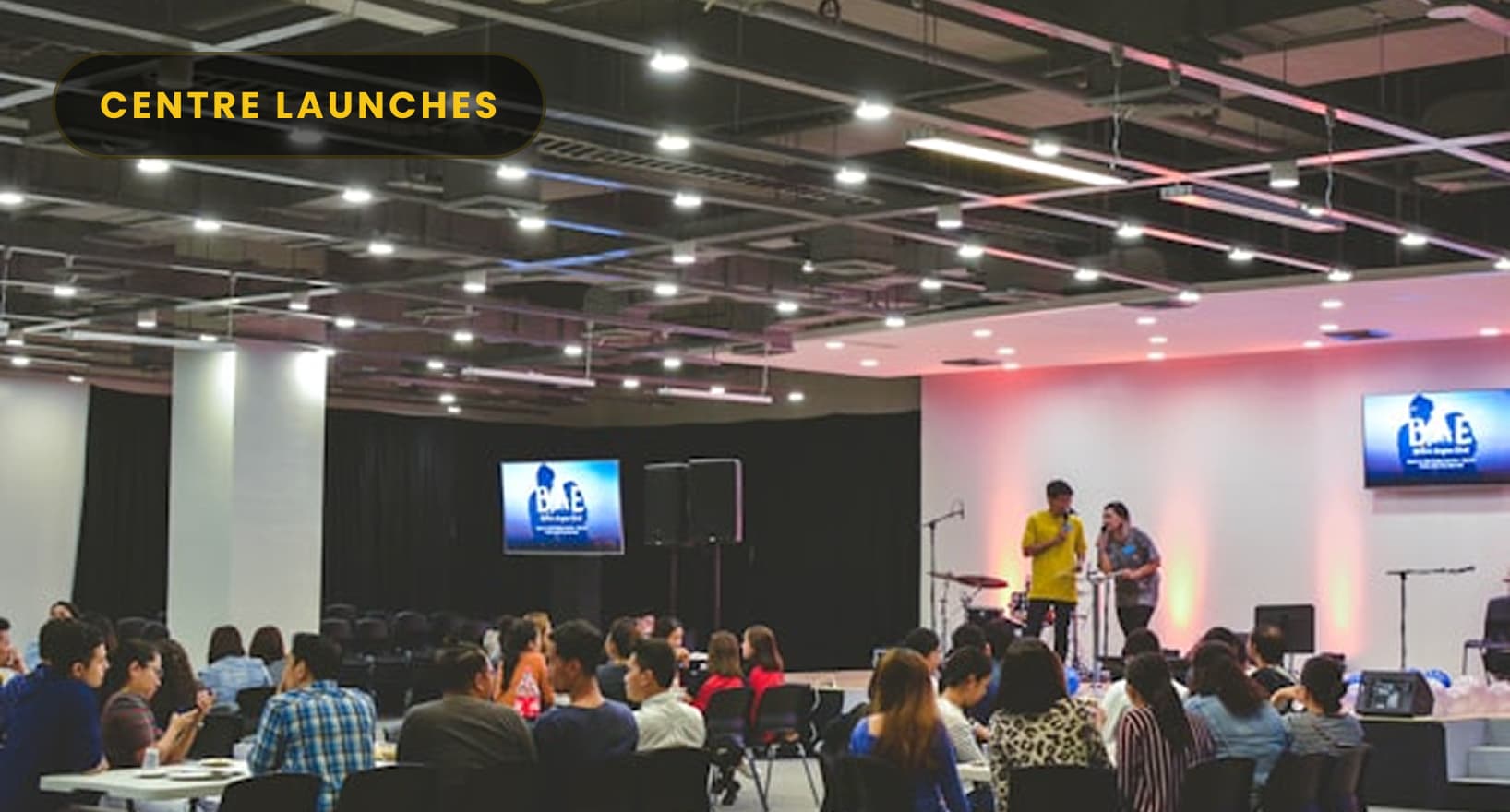 CENTRE LAUNCHES — FrameBoxx Pune campus launch event with audience and stage